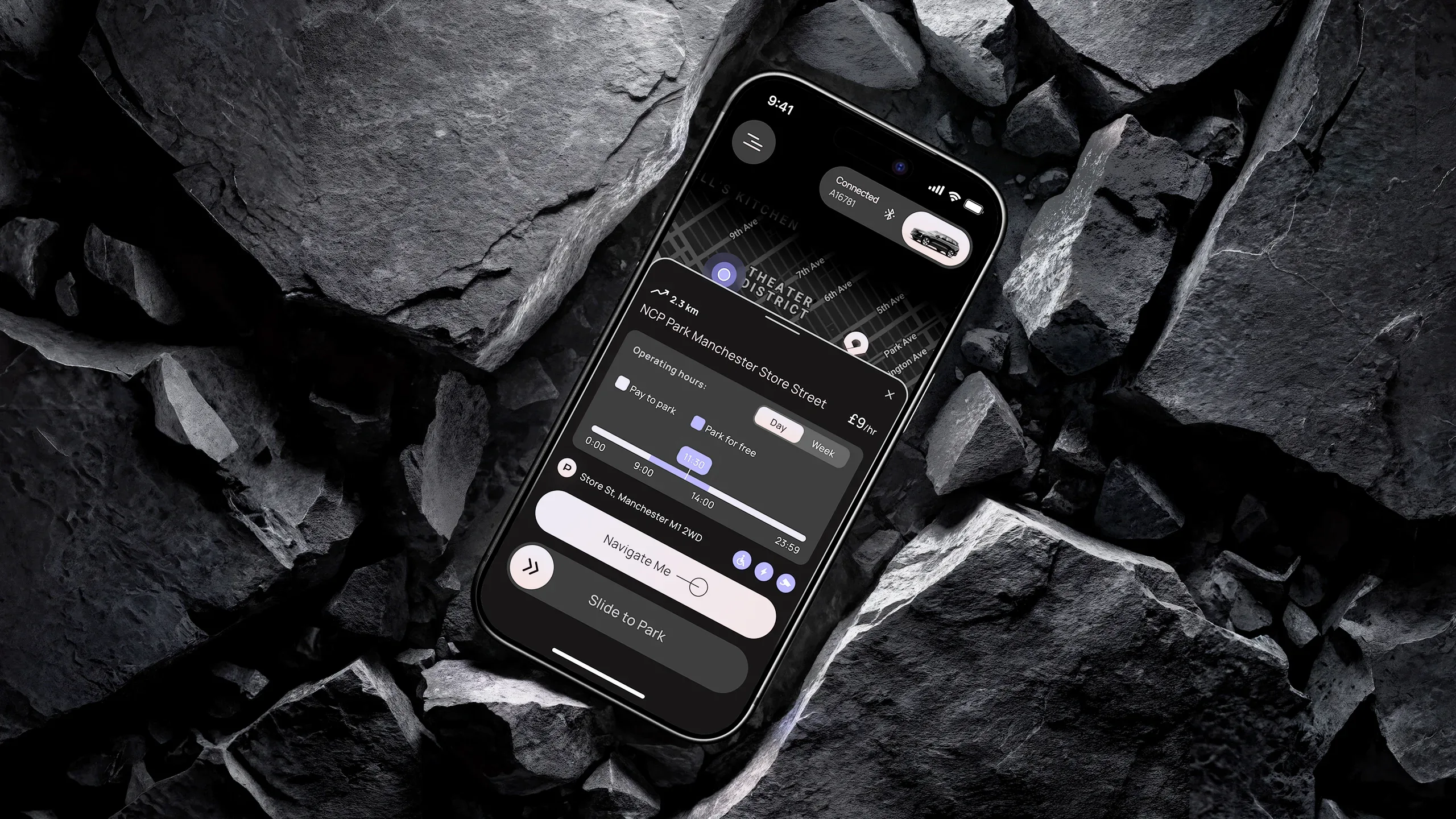 PARC parking app on a smartphone placed among rocks, showing parking details, operating hours, and navigation controls