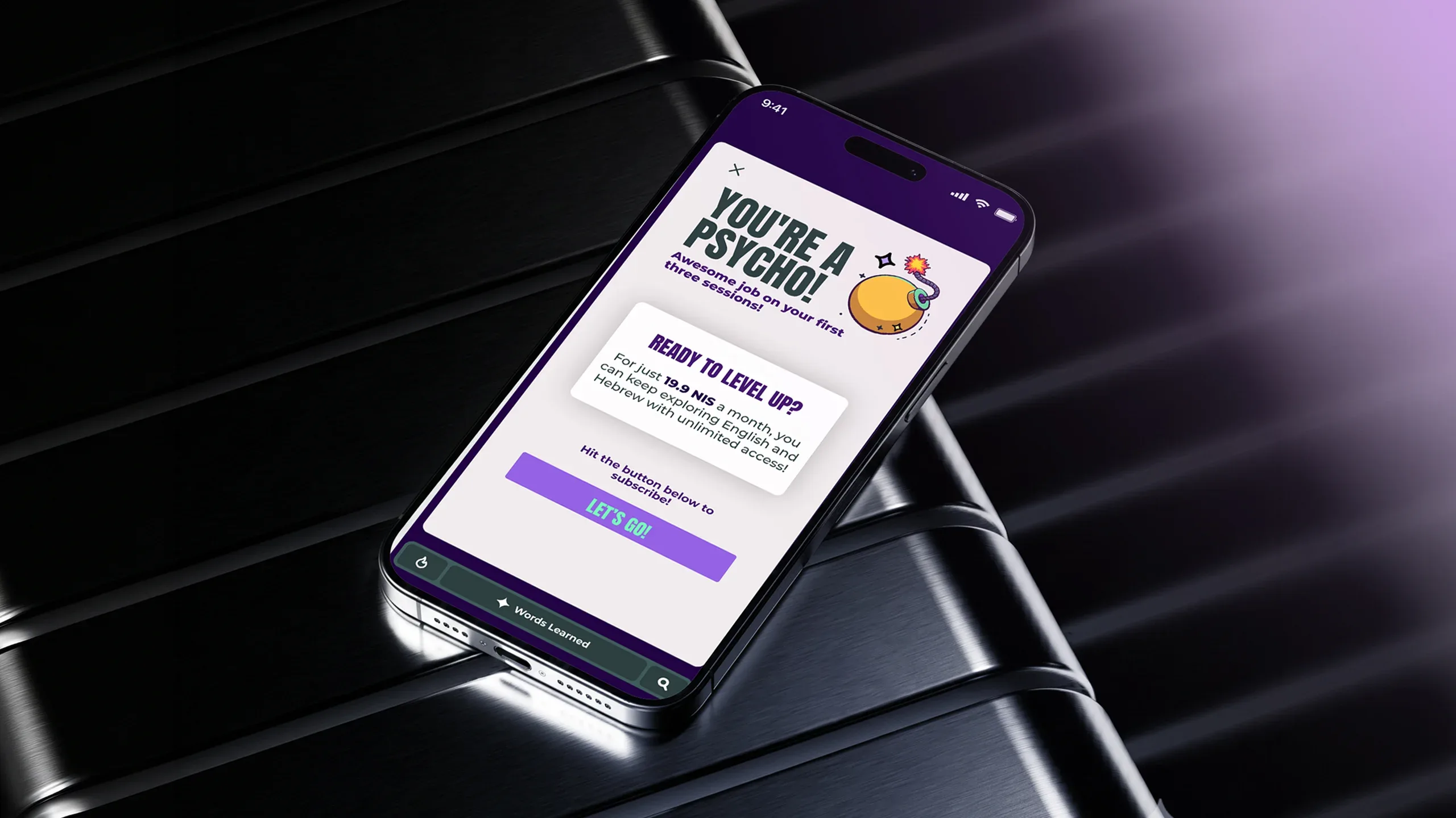 Smartphone displaying the Psycho language-learning app on a dark metallic surface