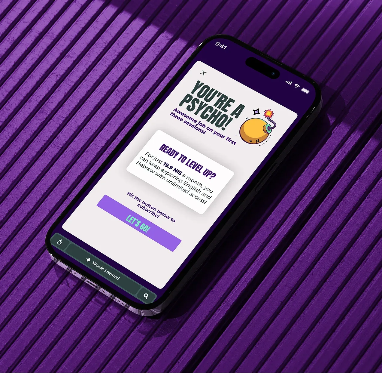 Angled smartphone displaying the Psycho language-learning app's subscription prompt on a purple textured surface