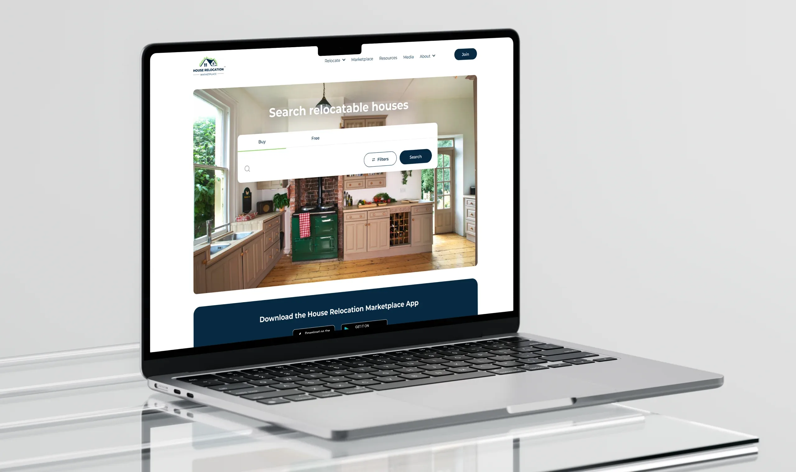 Laptop displaying the House Relocation Marketplace search interface over a kitchen background